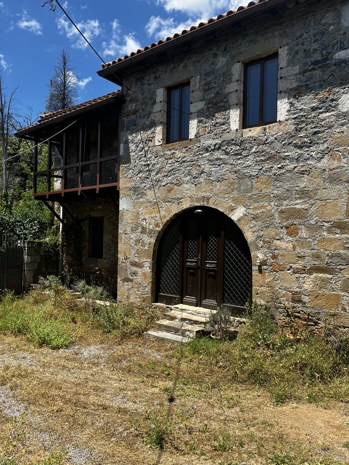 Traditional stone entrance of the property
